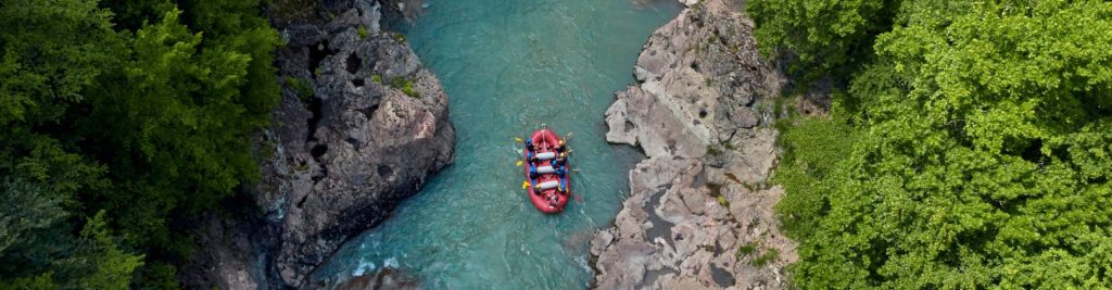 A group enjoying a thrilling rafting adventure on the Cabriel River in Valencia, combined with a premium wine tourism experience at Finca Calderón.
