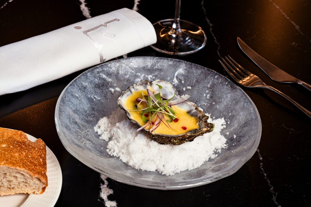 Gourmet tasting menu with contemporary local cuisine and wine pairing at Restaurante Finca Calderón, part of the exclusive premium package.